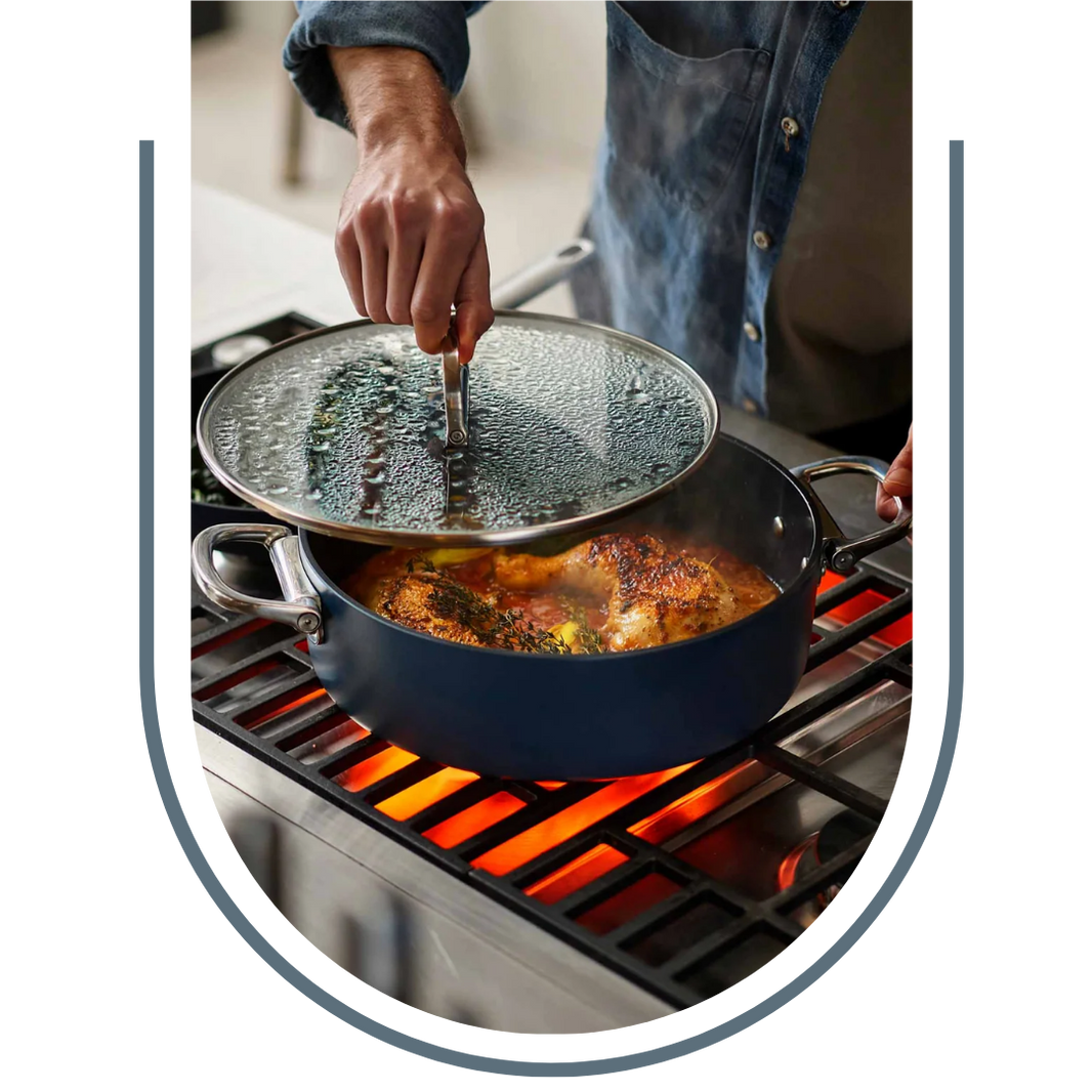 Person cooking on a grill with a pot and lid